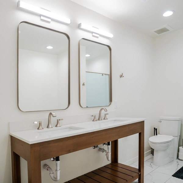 Inside a bathroom with two sinks at the landing our residential treatment center