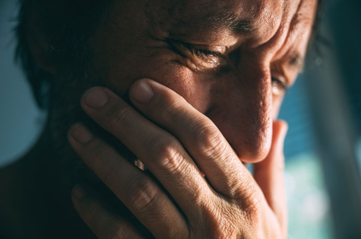 Man-having-alcohol-shakes - Jaywalker man experiencing alcohol shakes